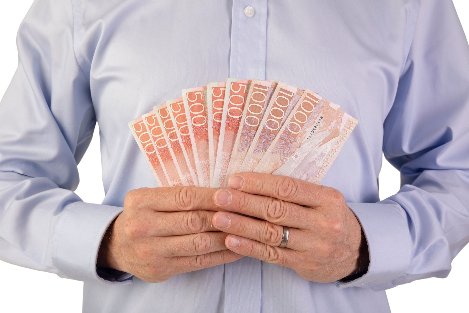 Holding five hundred and thousand swedish currency bills